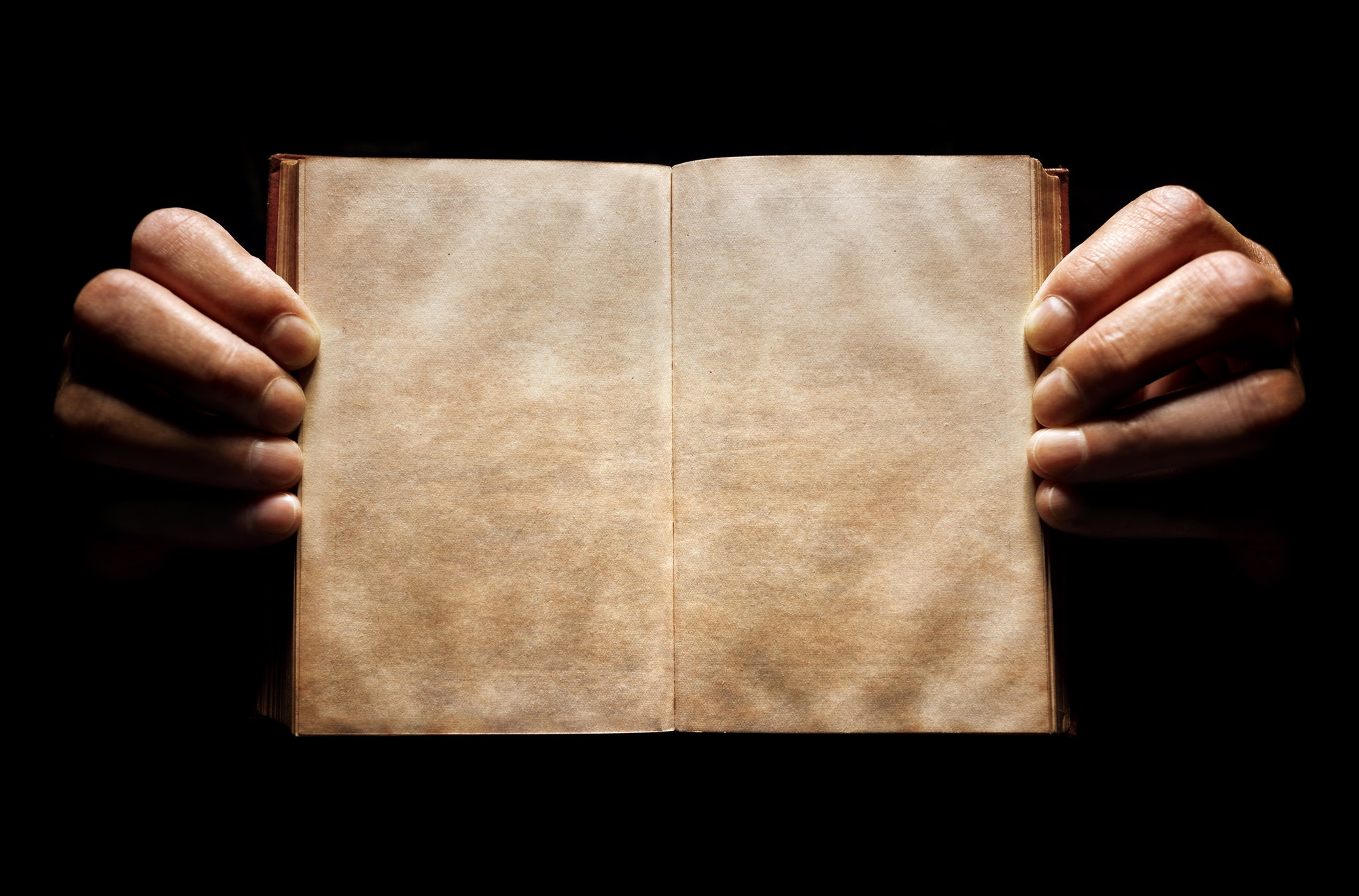 Hands holding an open empty book background